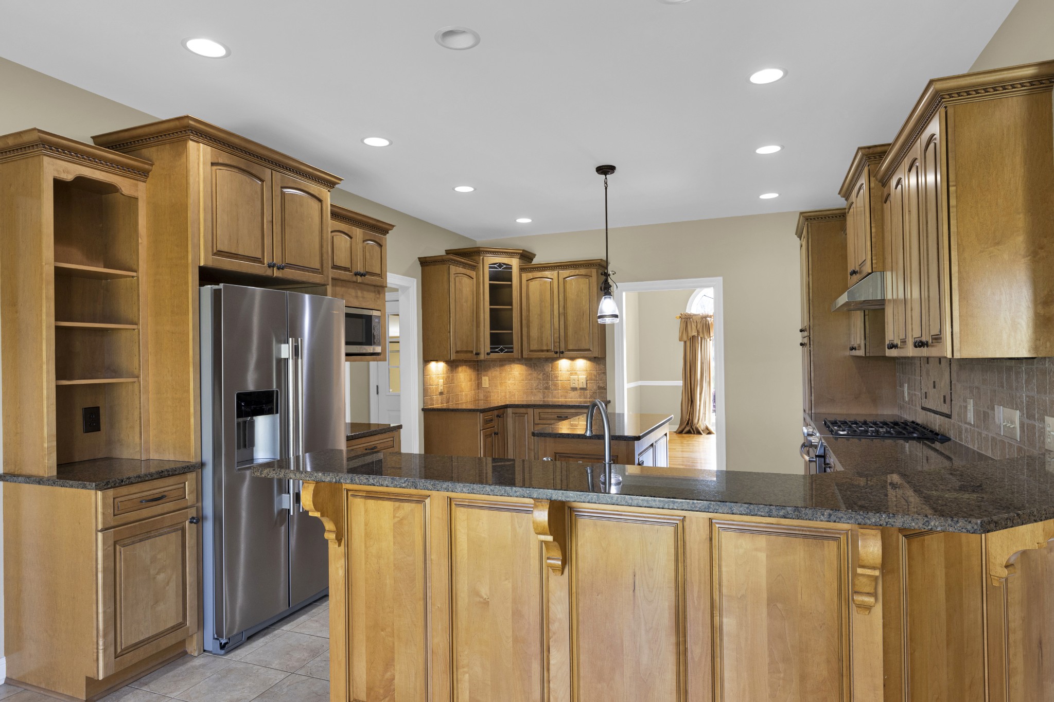 5144 Drake Road Cedar Hill, TN 37032 - Photo 44 of 80 a kitchen with stainless steel appliances granite countertop a refrigerator and a sink