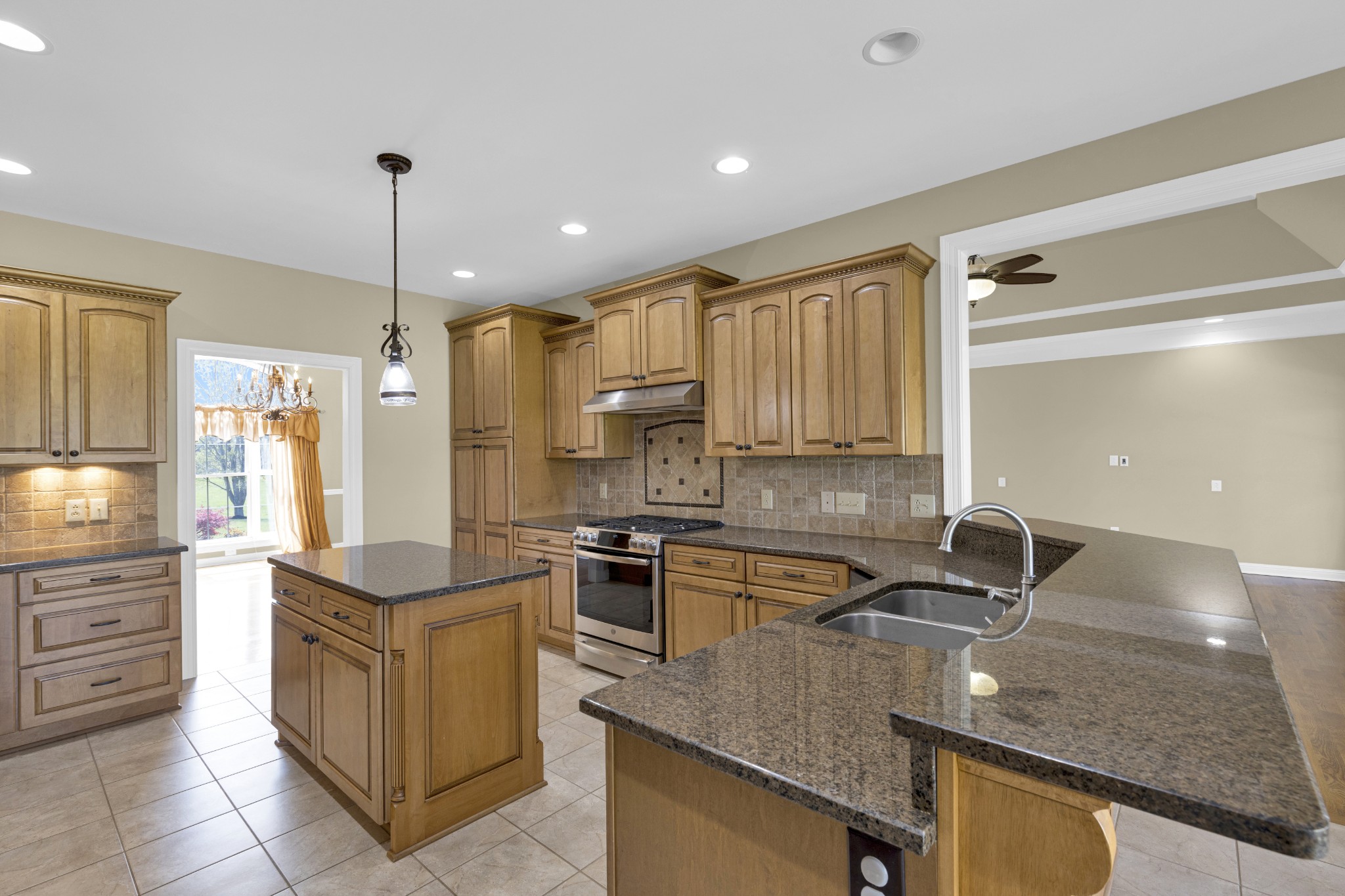 5144 Drake Road Cedar Hill, TN 37032 - Photo 45 of 80 a kitchen with stainless steel appliances granite countertop a sink stove and refrigerator