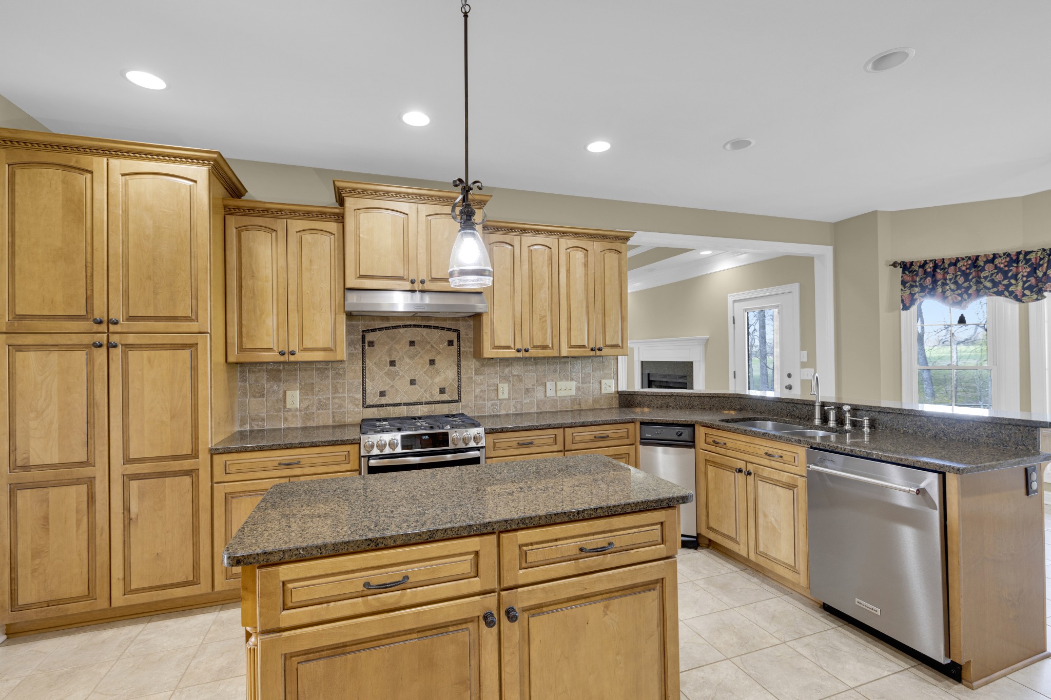5144 Drake Road Cedar Hill, TN 37032 - Photo 46 of 80 a kitchen with kitchen island granite countertop a sink stainless steel appliances and cabinets
