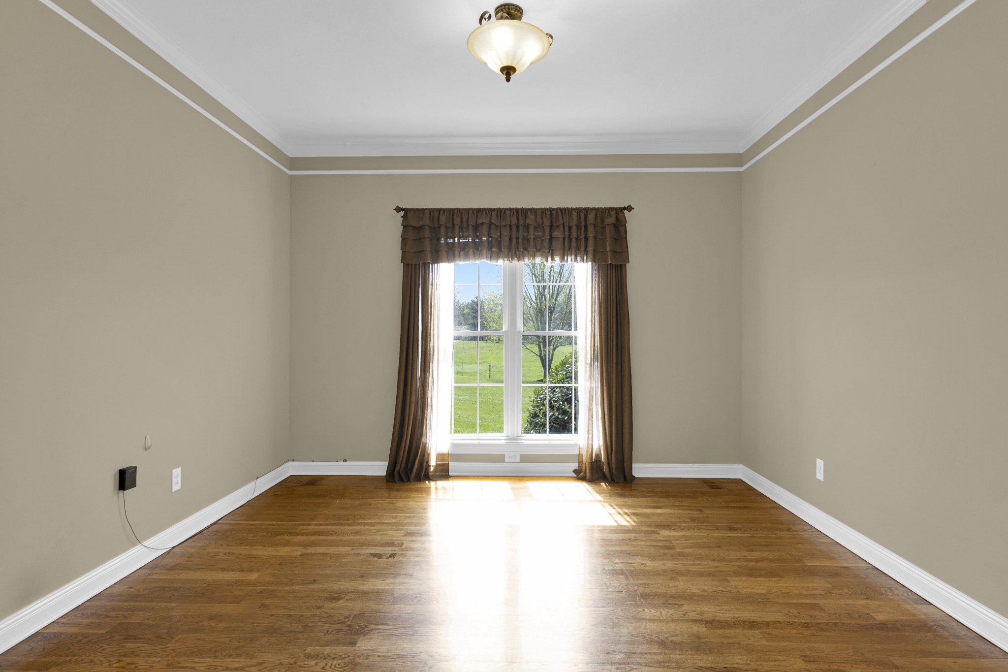 5144 Drake Road Cedar Hill, TN 37032 - Photo 49 of 80 a view of an empty room with wooden floor and a window