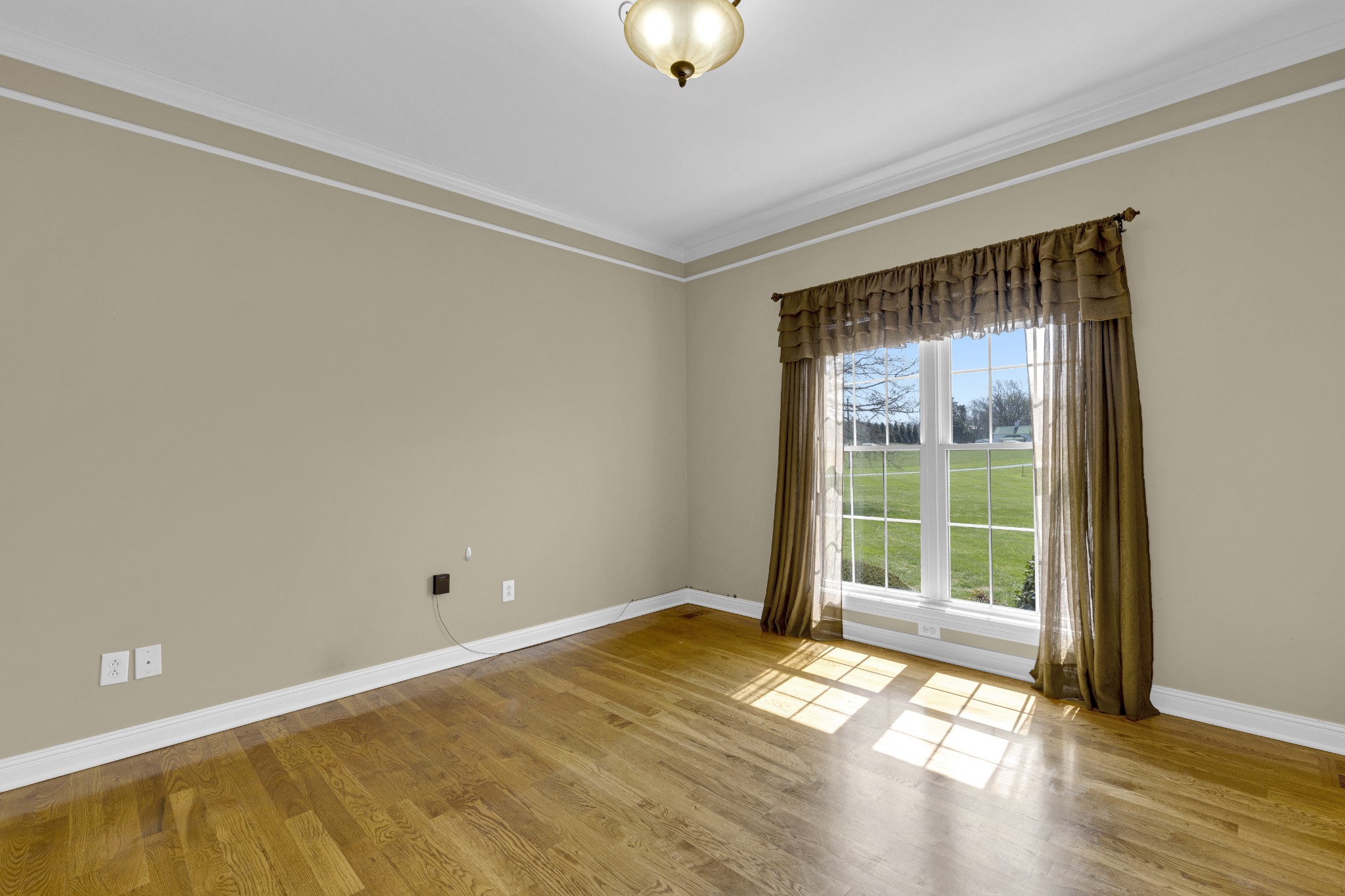 5144 Drake Road Cedar Hill, TN 37032 - Photo 50 of 80 a view of empty room with wooden floor and fan
