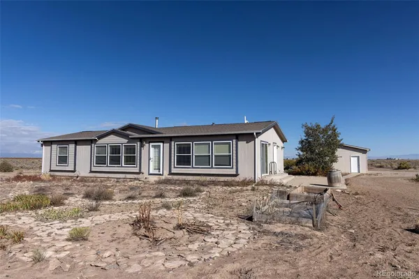 a house view with a backyard space