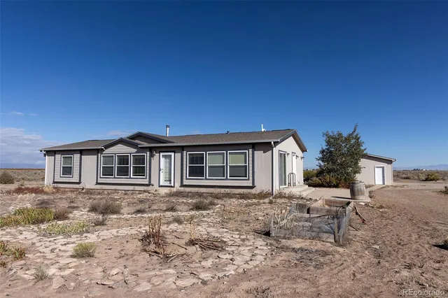 a house view with a backyard space