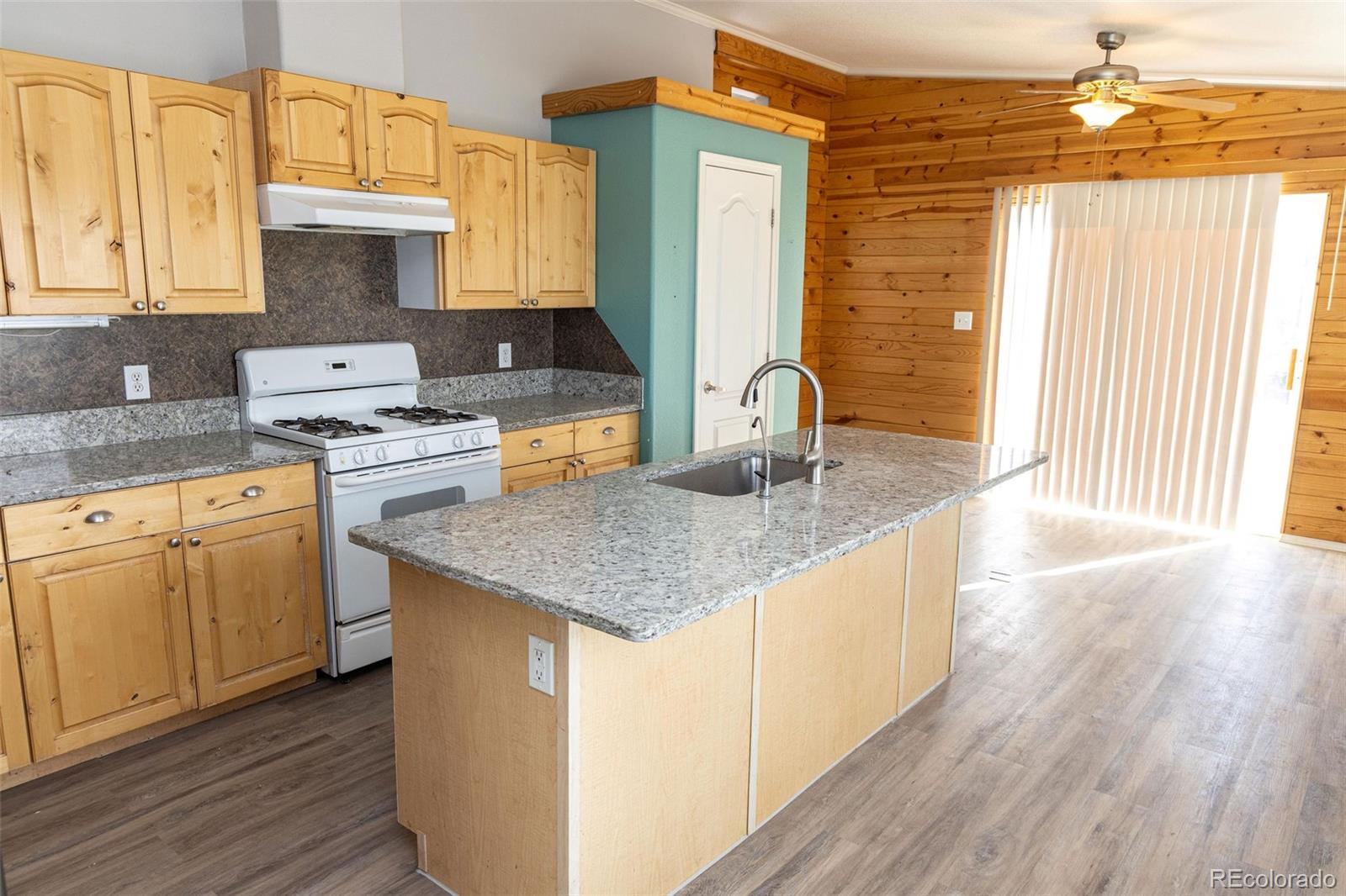 3211 Ln 2 North Mosca, CO 81146 - Photo 3 of 17 a kitchen with sink a stove and cabinets