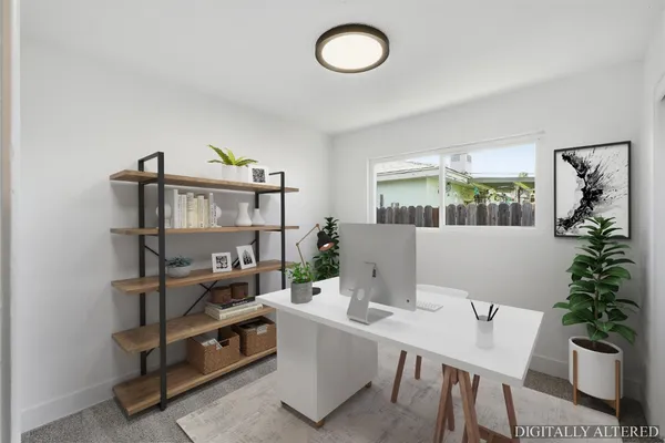 a view of a workspace with furniture