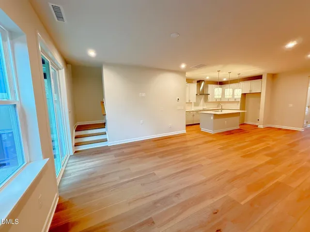 a view of kitchen and wooden floor