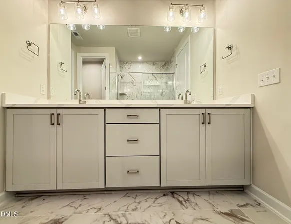 a bathroom with a sink and mirror