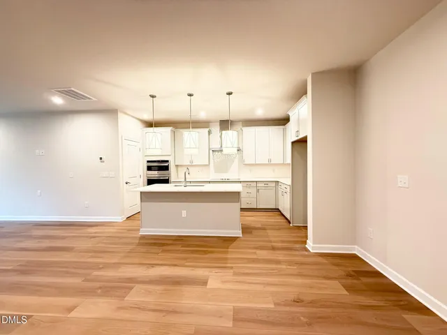 a view of kitchen with wooden floor