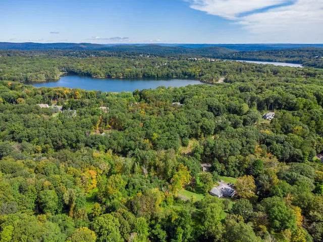 a view of a field with an ocean view