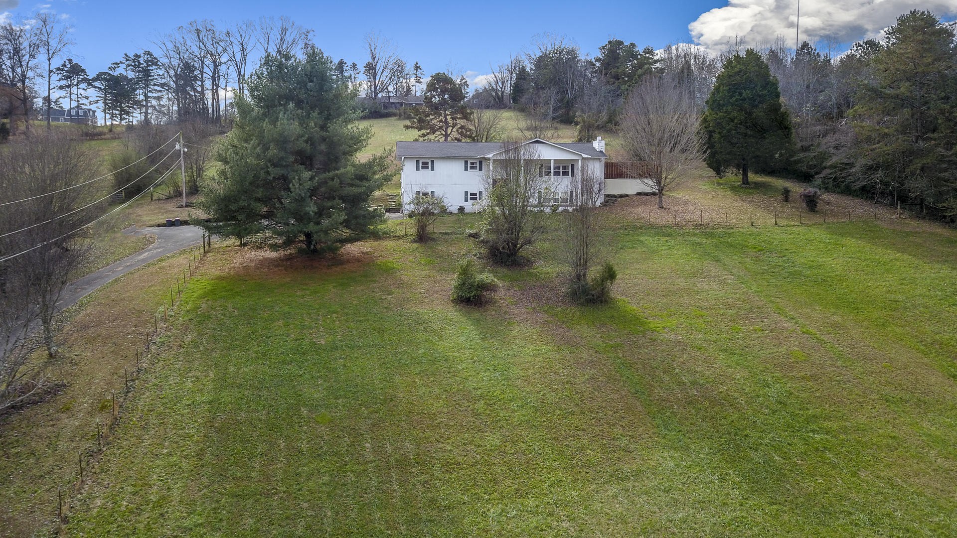 2598 Maple Hill Road Loudon, TN 37774 - Photo 32 of 36 an aerial view of residential houses with outdoor space and trees