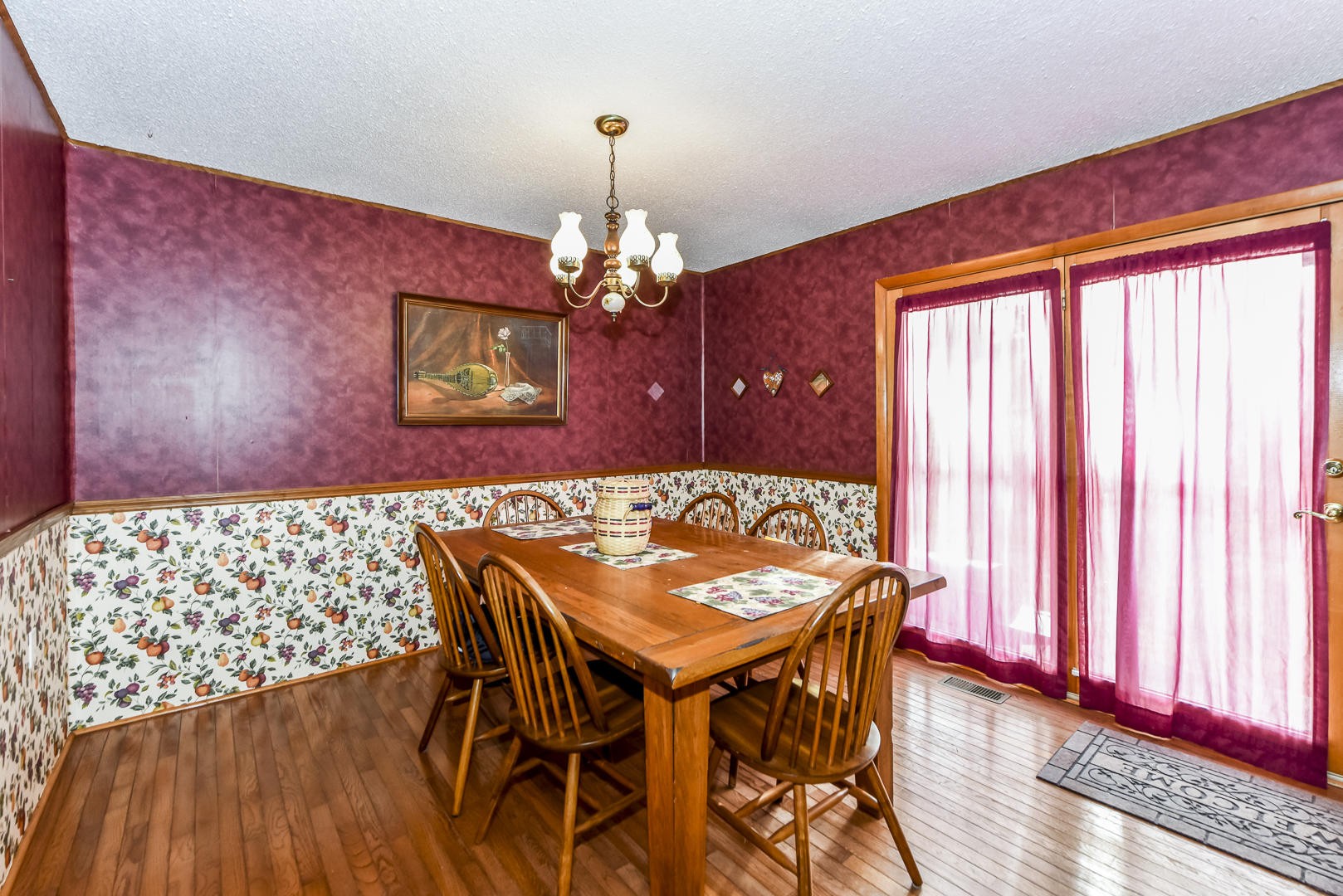 2598 Maple Hill Road Loudon, TN 37774 - Photo 10 of 36 a view of a dining room with furniture and wooden floor