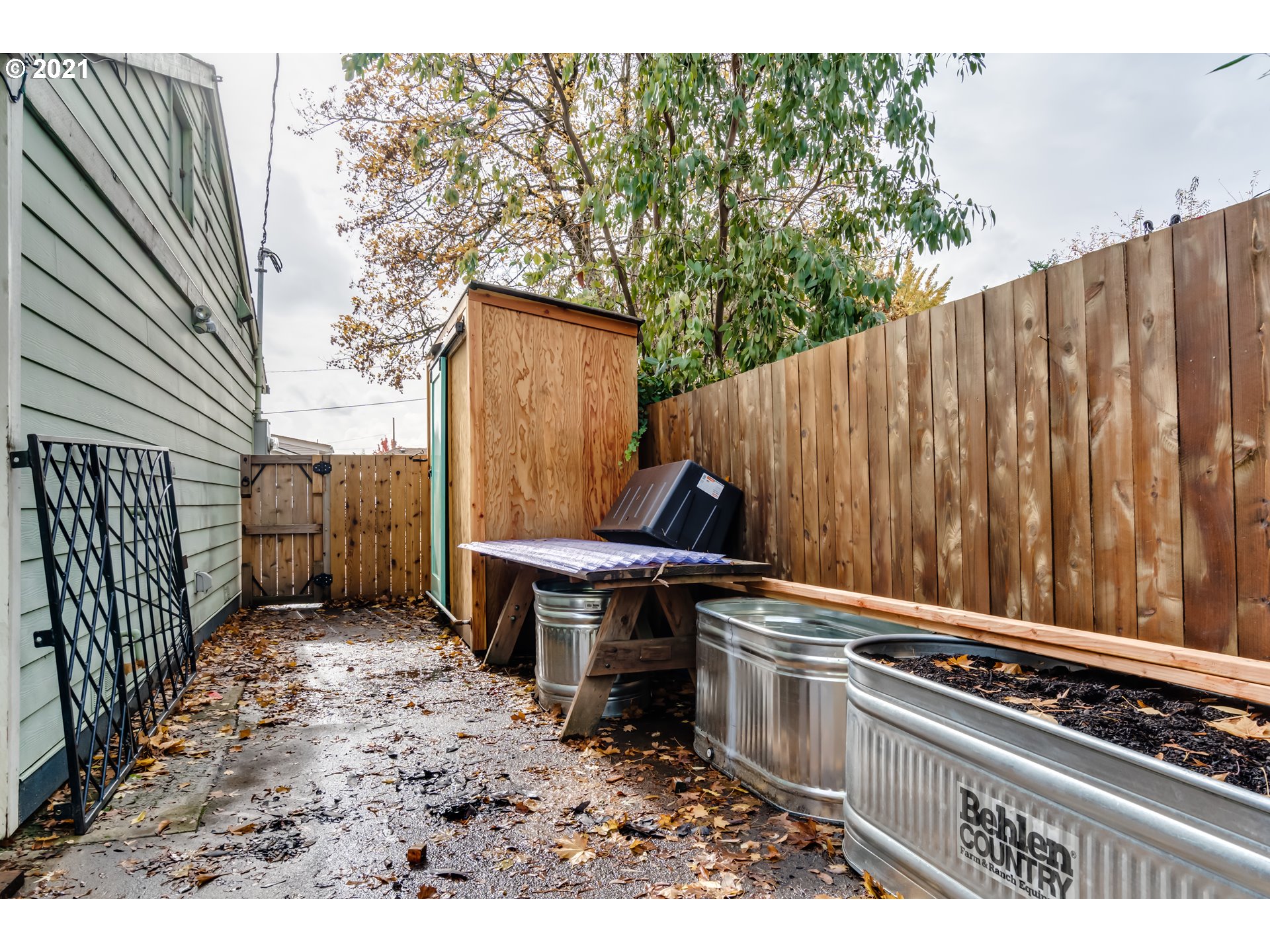 3250 B Street Springfield, OR 97478 - Photo 26 of 31 a view of a patio with table and chairs with wooden floor and fence
