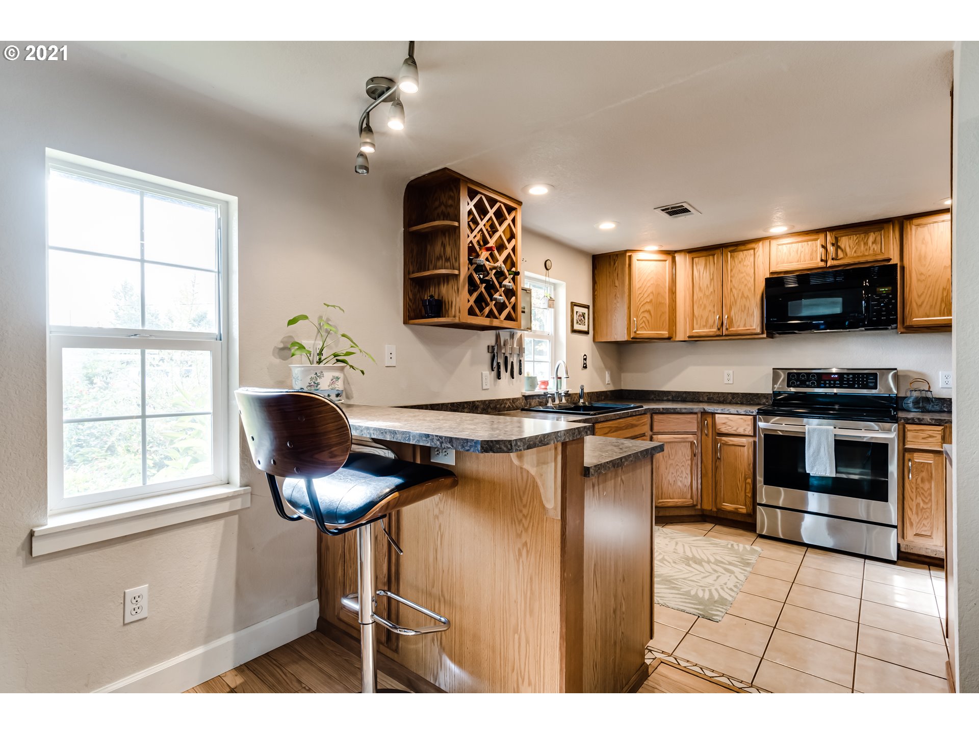 3250 B Street Springfield, OR 97478 - Photo 6 of 31 a living room with stainless steel appliances kitchen island granite countertop furniture and a kitchen view