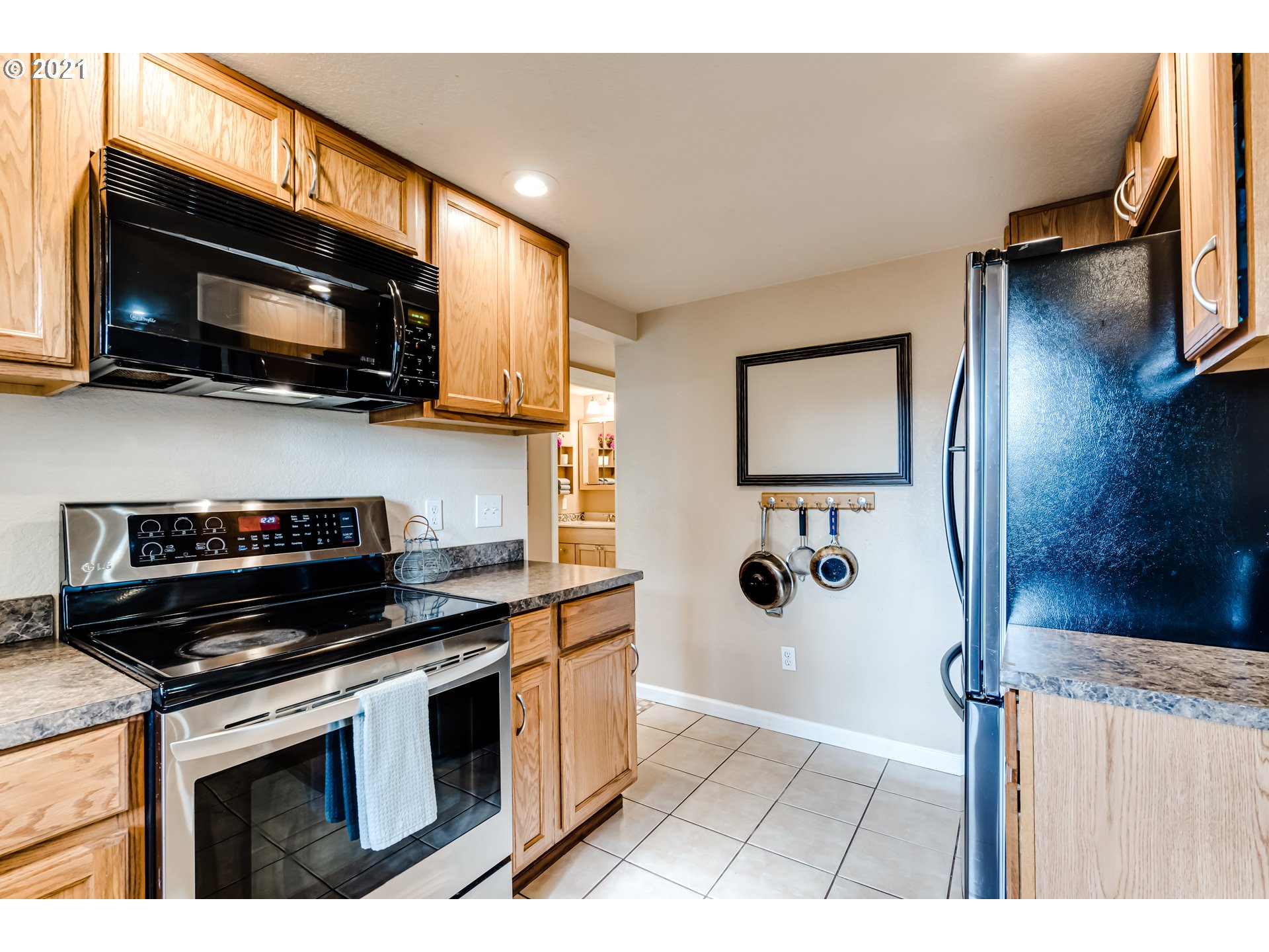 3250 B Street Springfield, OR 97478 - Photo 8 of 31 a kitchen with a stove and a microwave