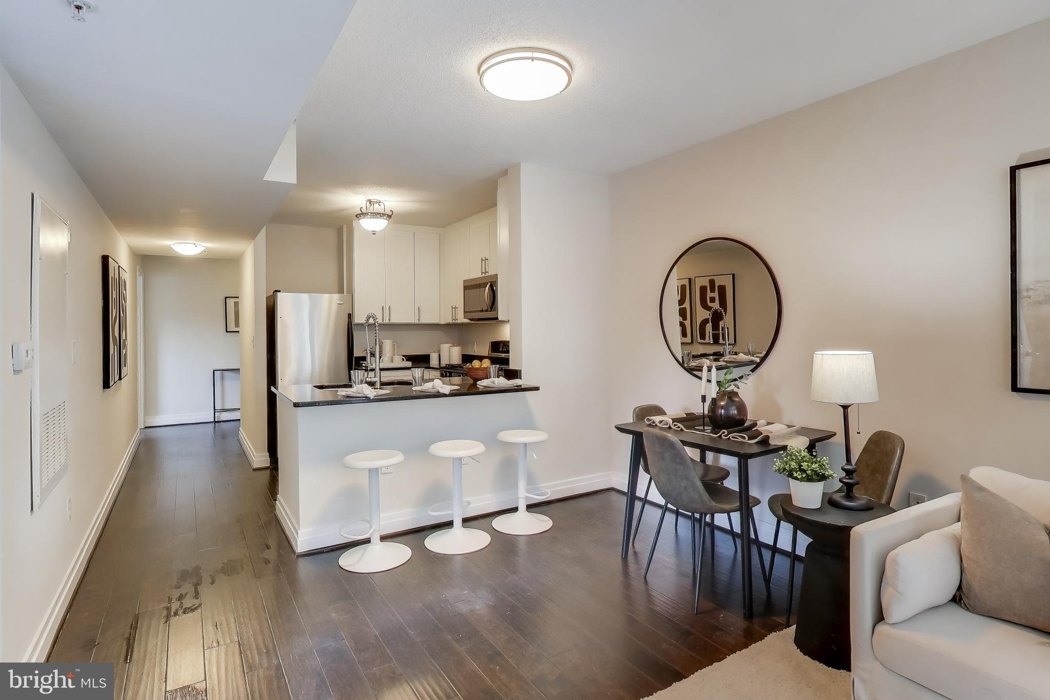 915 E Street Northwest, Unit 1013 Washington, DC 20004 - Photo 11 of 39 Dining Open to Kitchen