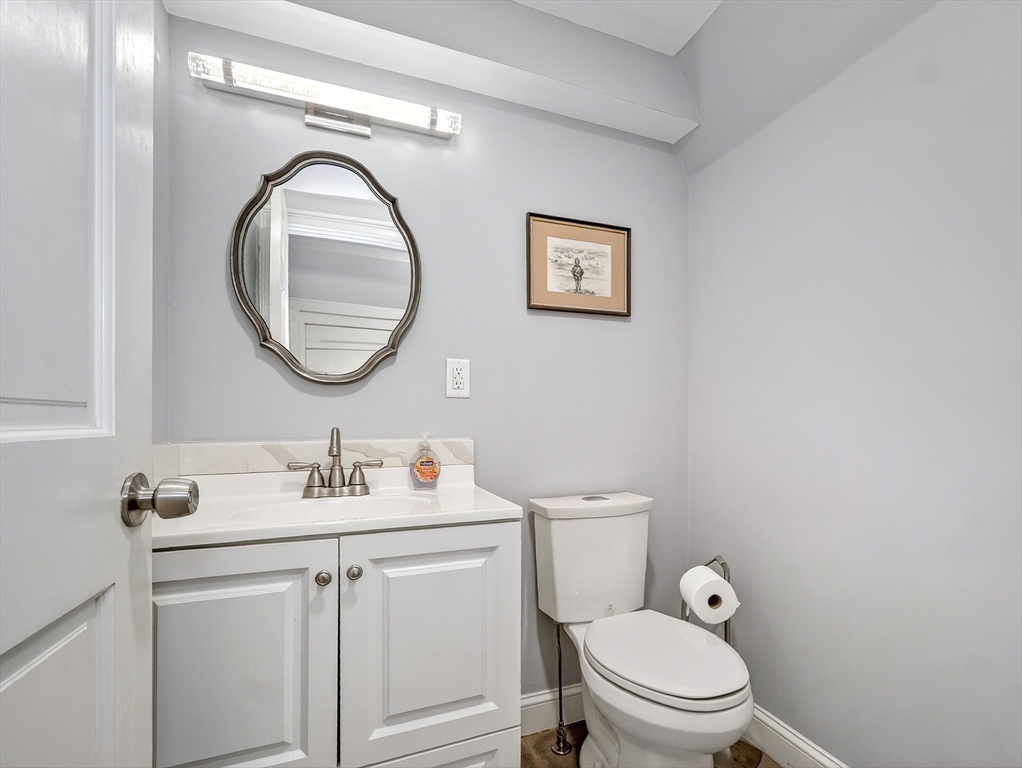 87 Payson Road Brookline, MA 02467 - Photo 17 of 41 a bathroom with a toilet a sink and mirror