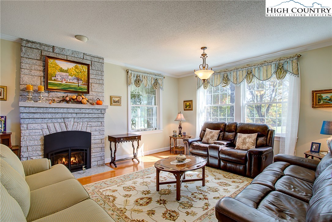 267 Vestal Road Sparta, NC 28675 - Photo 13 of 43 a living room with furniture fireplace and window