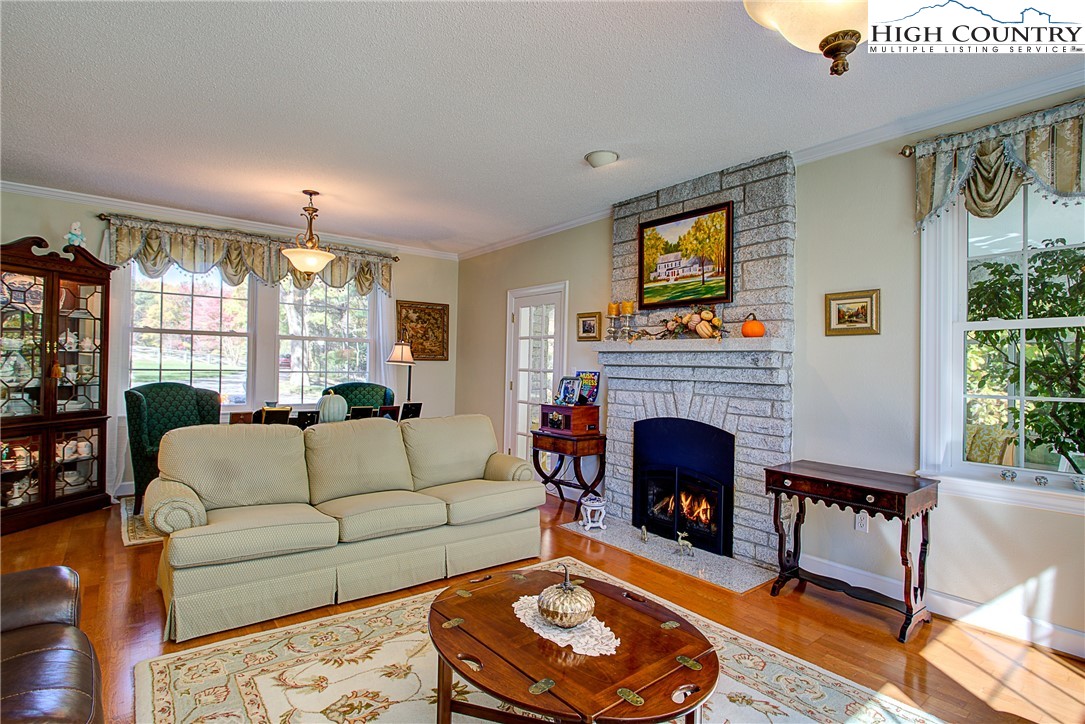 267 Vestal Road Sparta, NC 28675 - Photo 14 of 43 a living room with furniture and a fireplace