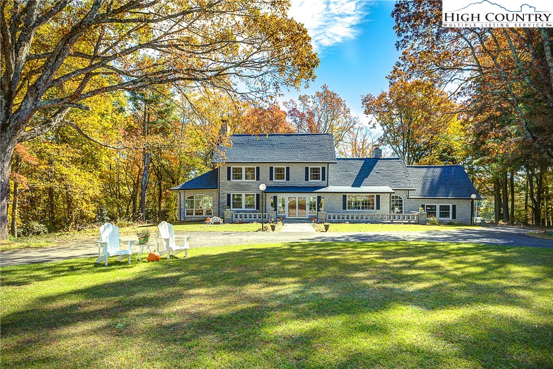 267 Vestal Road Sparta, NC 28675 - Photo 2 of 43 a front view of a house with a big yard