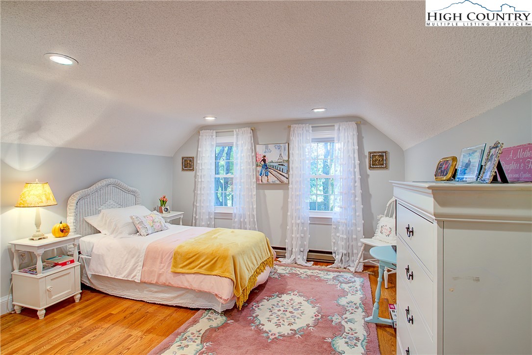 267 Vestal Road Sparta, NC 28675 - Photo 27 of 43 a bedroom with a bed and a refrigerator