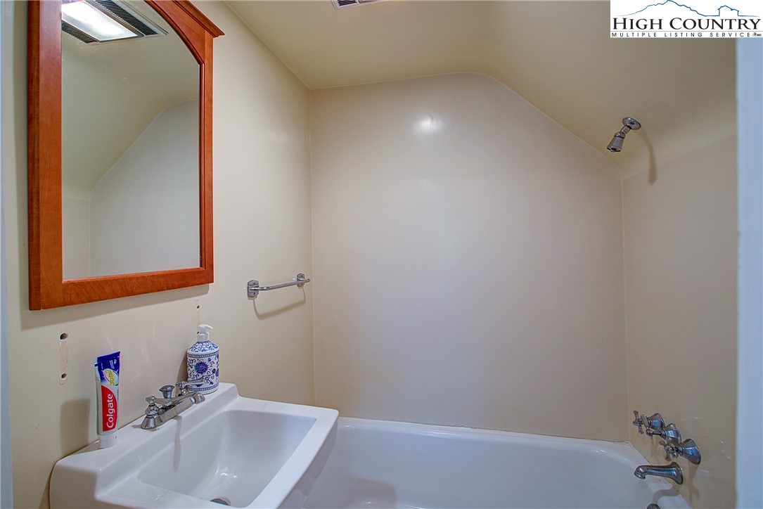 267 Vestal Road Sparta, NC 28675 - Photo 28 of 43 a bathroom with a sink and a mirror