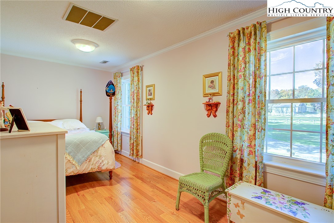 267 Vestal Road Sparta, NC 28675 - Photo 33 of 43 a bedroom with a bed and a window