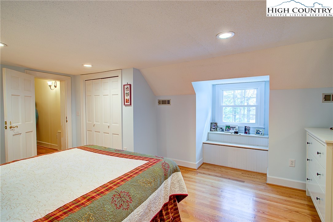 267 Vestal Road Sparta, NC 28675 - Photo 36 of 43 a bedroom with a bed and a window