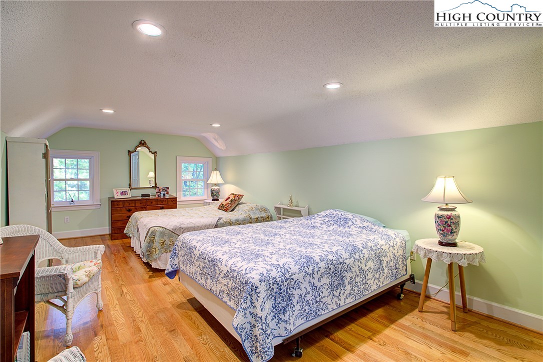267 Vestal Road Sparta, NC 28675 - Photo 37 of 43 a bedroom with two beds and painted walls
