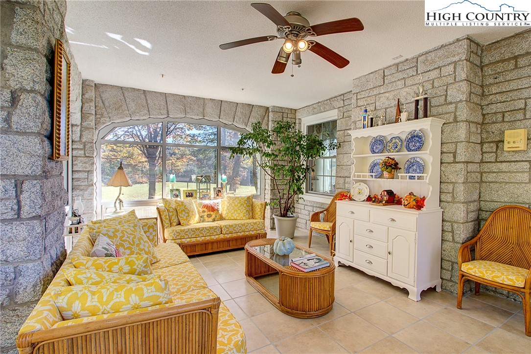 267 Vestal Road Sparta, NC 28675 - Photo 41 of 43 a living room with furniture and a chandelier