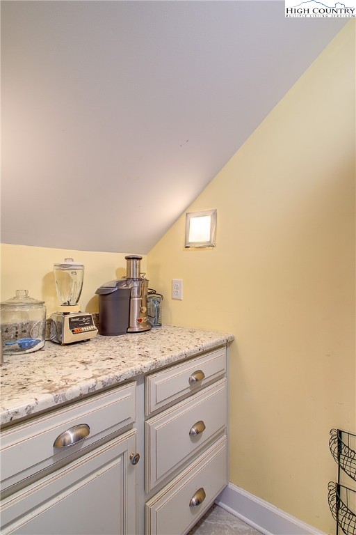 267 Vestal Road Sparta, NC 28675 - Photo 42 of 43 a bathroom with a granite countertop sink and vanity