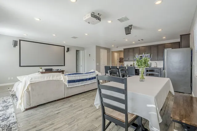 a view of a dining room with furniture and window