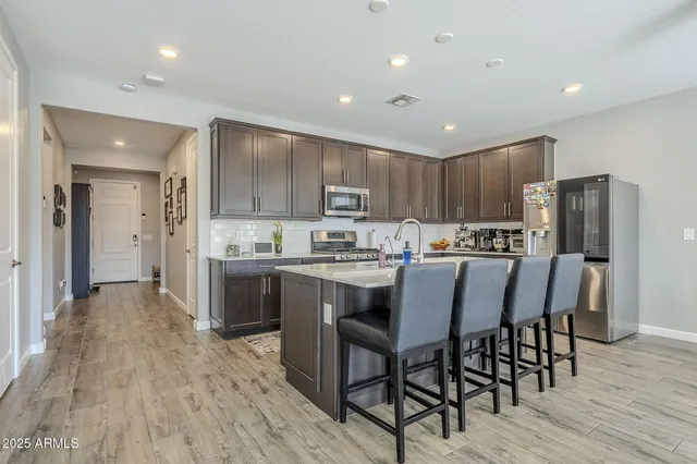 a kitchen with a sink cabinets and window