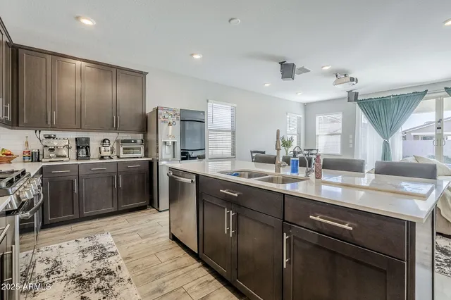 a kitchen with a sink and a window