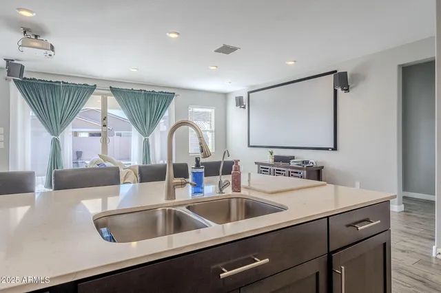 a kitchen with stainless steel appliances granite countertop a stove a microwave and cabinets