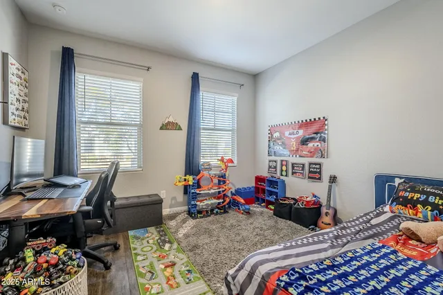 a bathroom with a sink vanity mirror and toilet