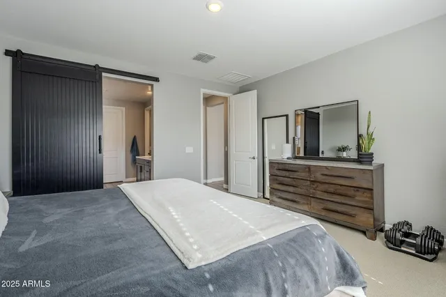 a bathroom with a sink vanity and a tub