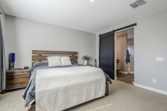 a view of walk in closet with clothes
