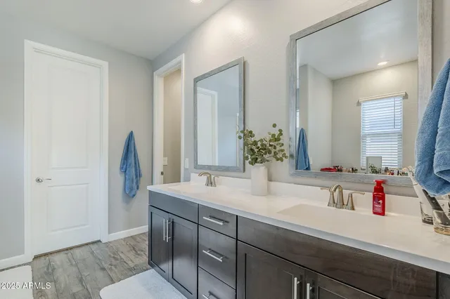 a living room with furniture and a bookshelf