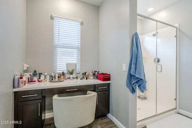 a view of workspace with wooden floor windows