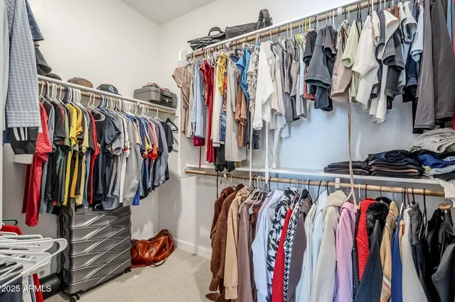 a utility room with dryer and bicycles