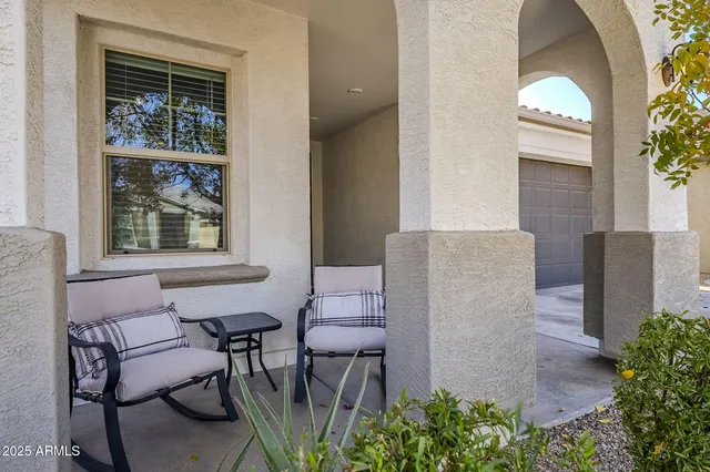 a dining room with furniture and a window
