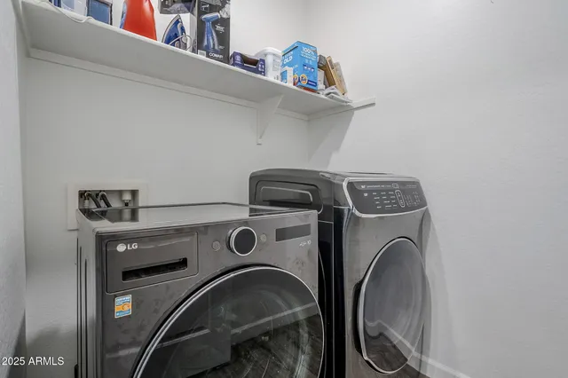 a view of living room with furniture and a rug
