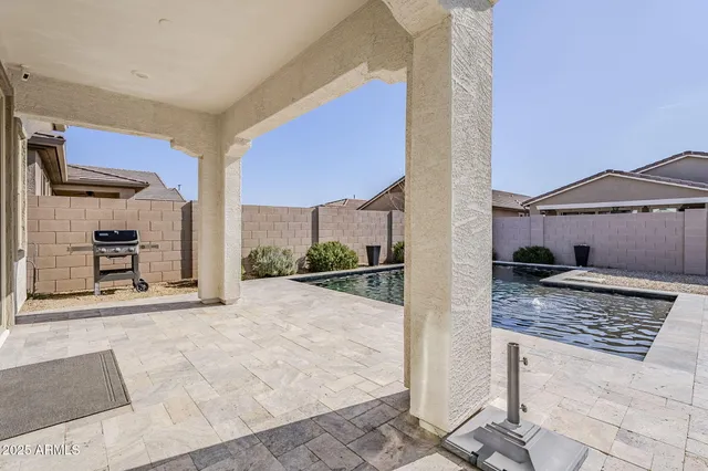 a outdoor living space with furniture and a rug