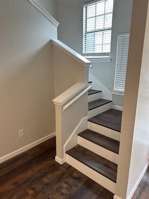 4520 Speedway, Unit A Austin, TX 78751 - Photo 9 of 9 Stairs featuring a textured wall and wood finished floors