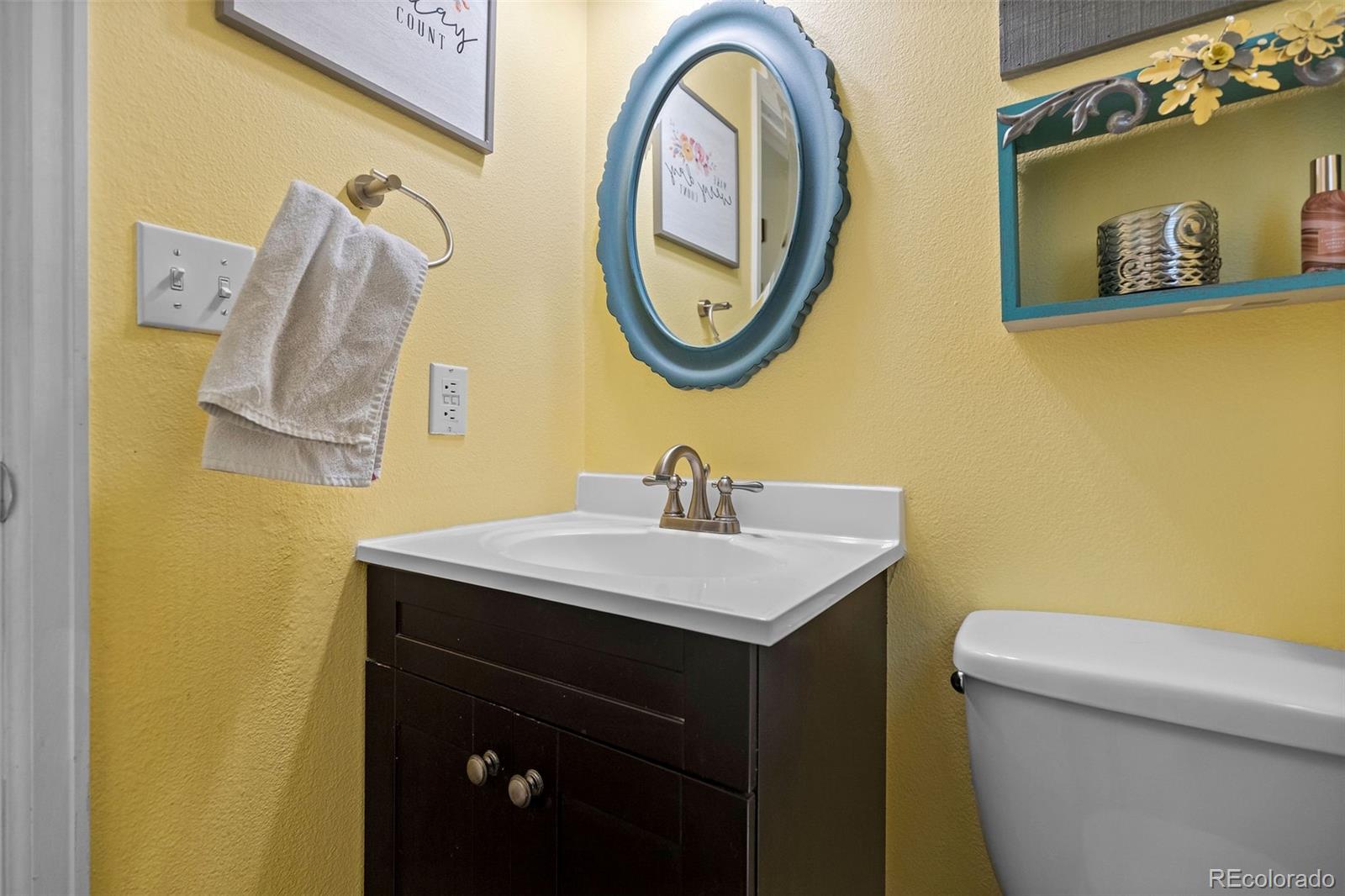 10565 Hyacinth Place Highlands Ranch, CO 80129 - Photo 16 of 33 a bathroom with a sink and a mirror