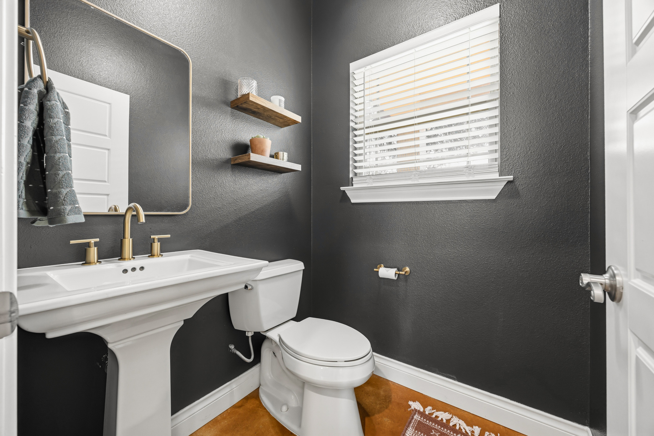 4105 Summit Hurst New Braunfels, TX 78132 - Photo 11 of 36 a bathroom with a sink a toilet and a mirror