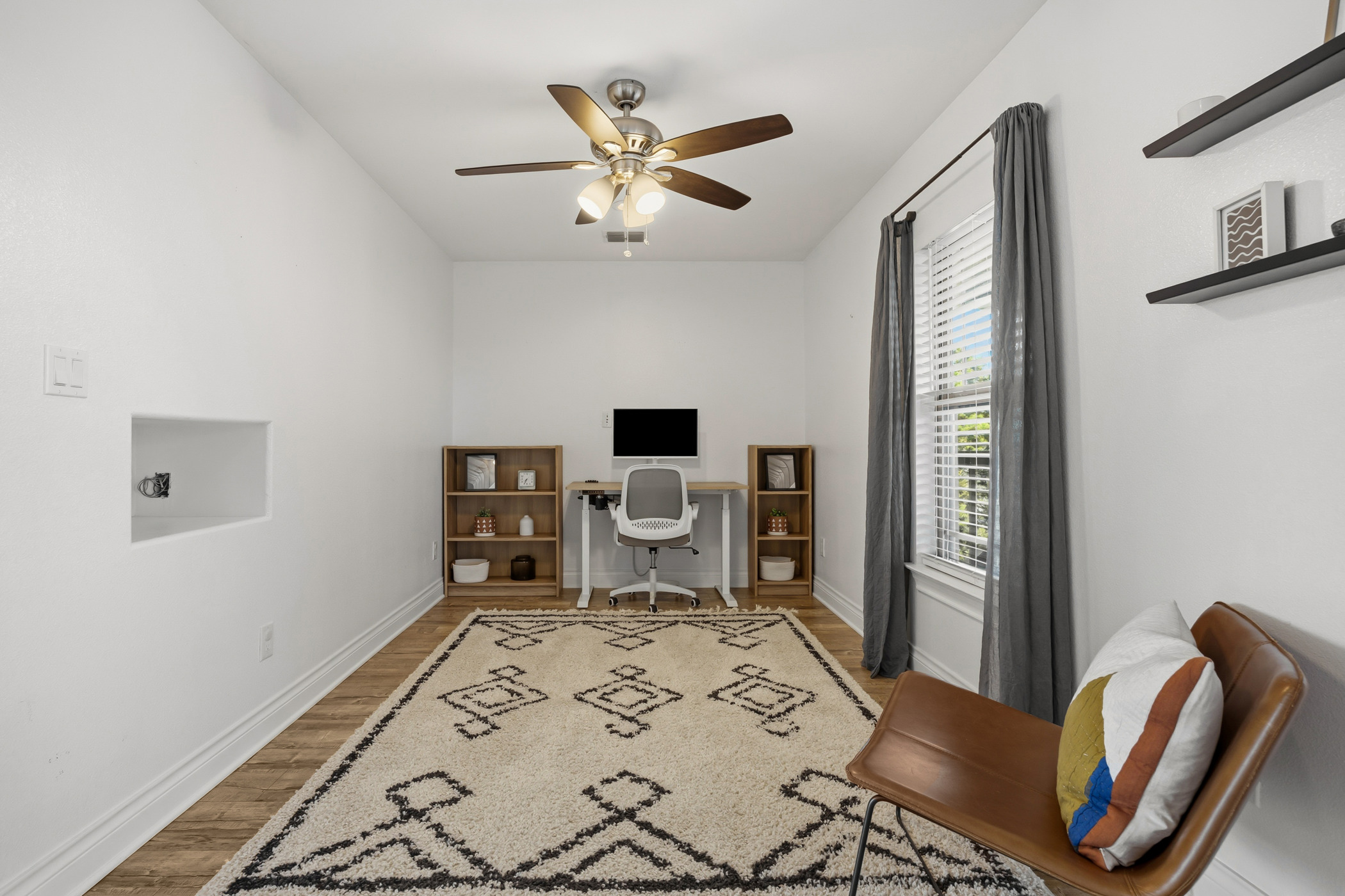 4105 Summit Hurst New Braunfels, TX 78132 - Photo 21 of 36 a bedroom with a bed and a chandelier