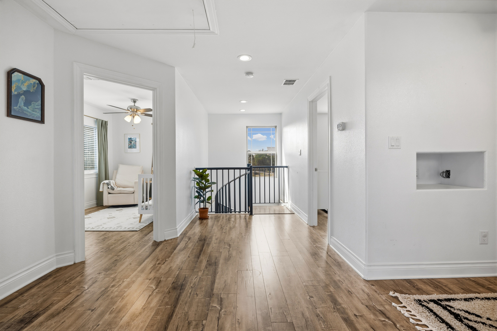 4105 Summit Hurst New Braunfels, TX 78132 - Photo 22 of 36 a view of a hallway with wooden floor and a bathroom