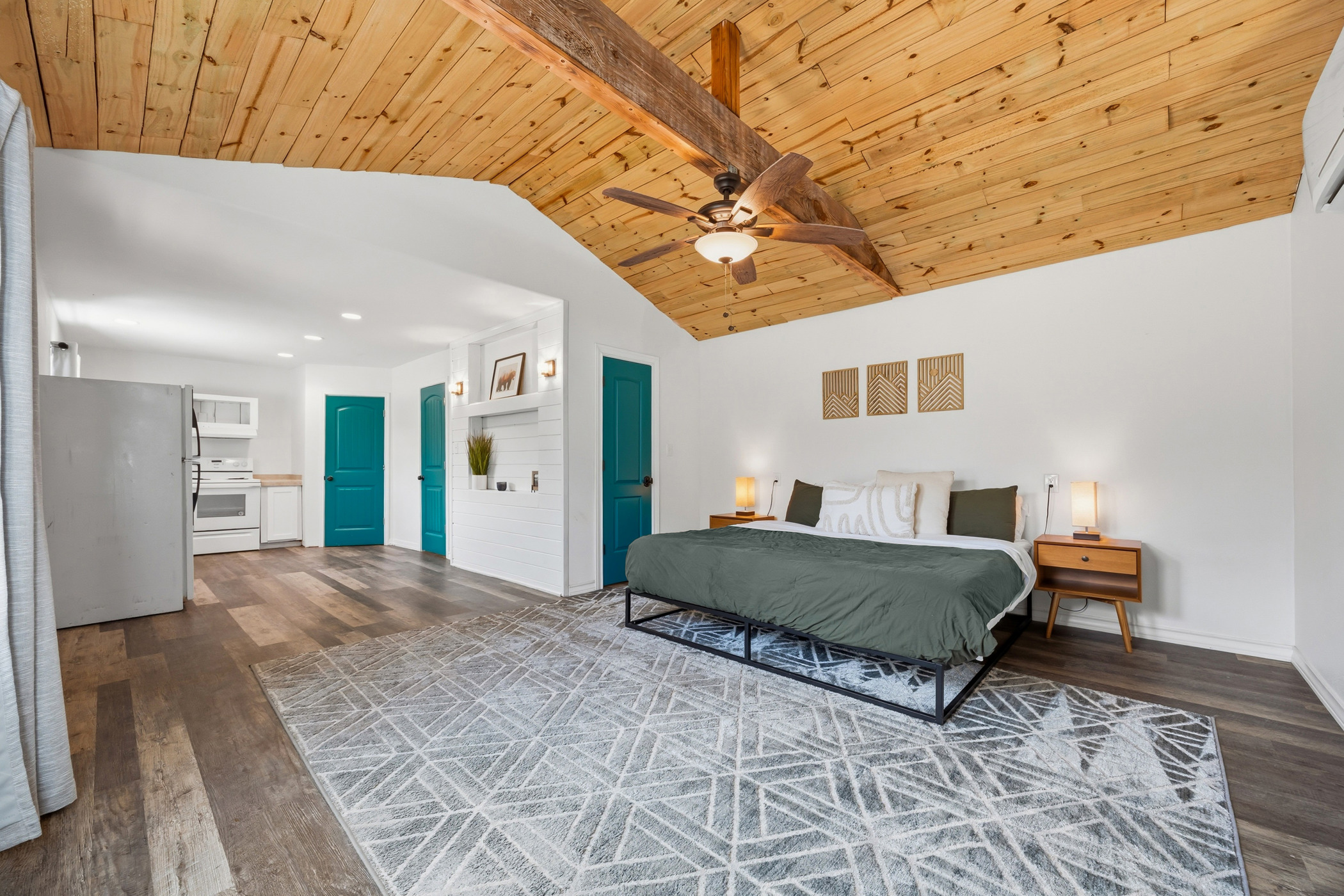 4105 Summit Hurst New Braunfels, TX 78132 - Photo 29 of 36 a spacious bedroom with a large bed and a chandelier