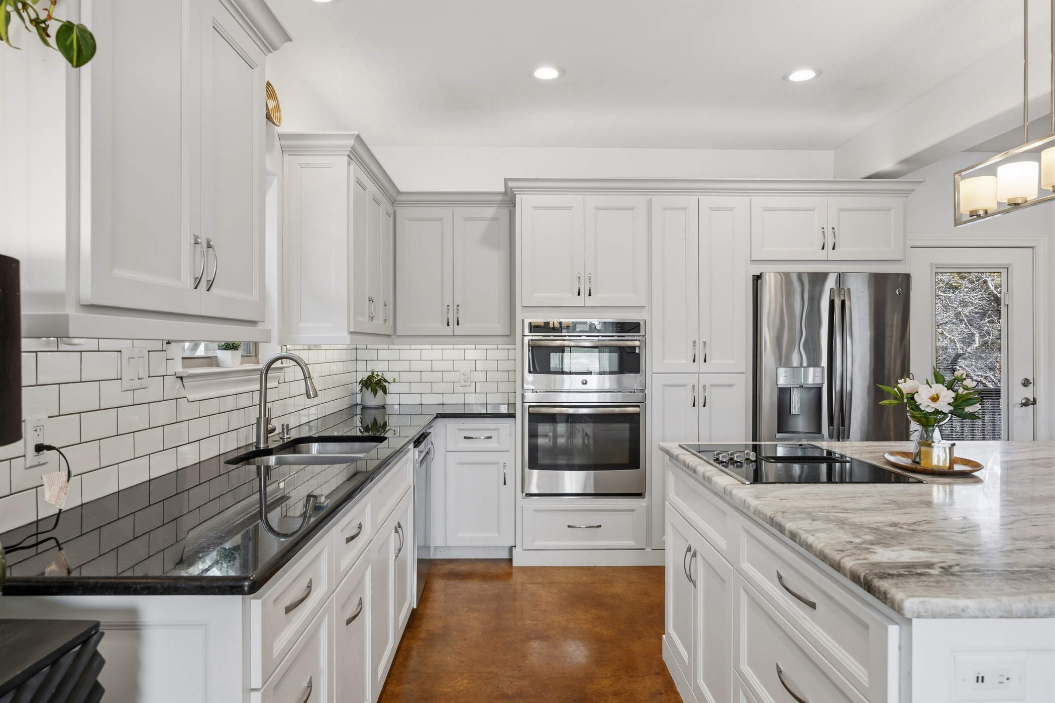 4105 Summit Hurst New Braunfels, TX 78132 - Photo 6 of 36 a kitchen with granite countertop a sink stainless steel appliances and cabinets